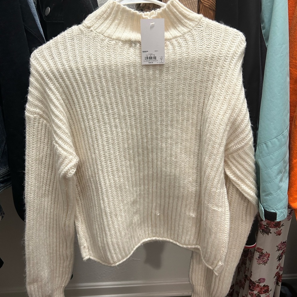 Off white, turtle neck sweater.
